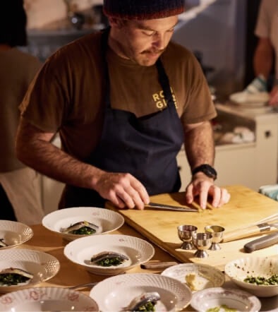 Man cutting ingredients on chopping board