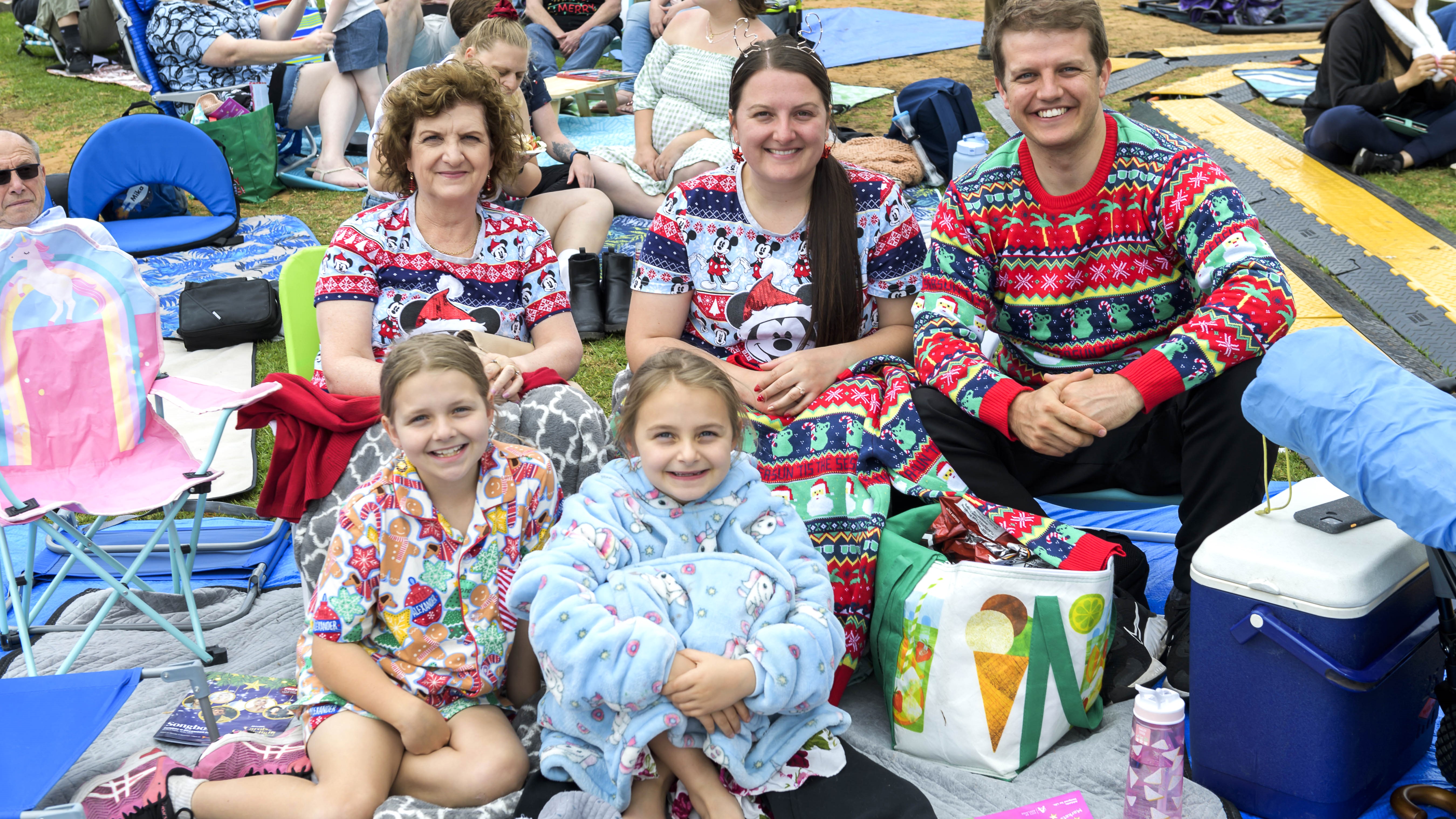 Family in Christmas outfits