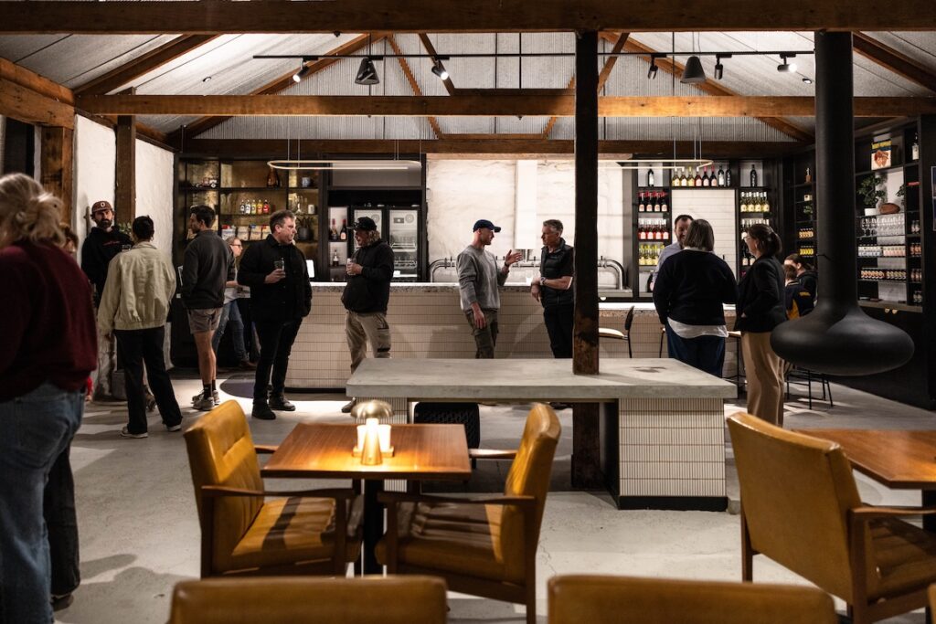 A group of patrons in front of the bar at Old Mill brewery