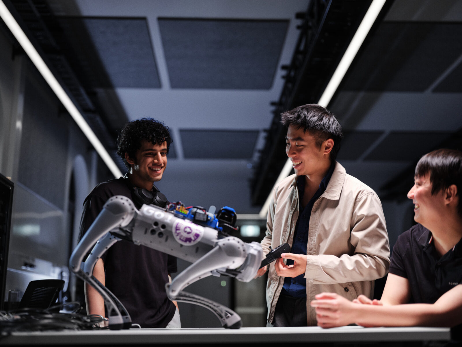 Students at the institute for machine learning with a robotic dog
