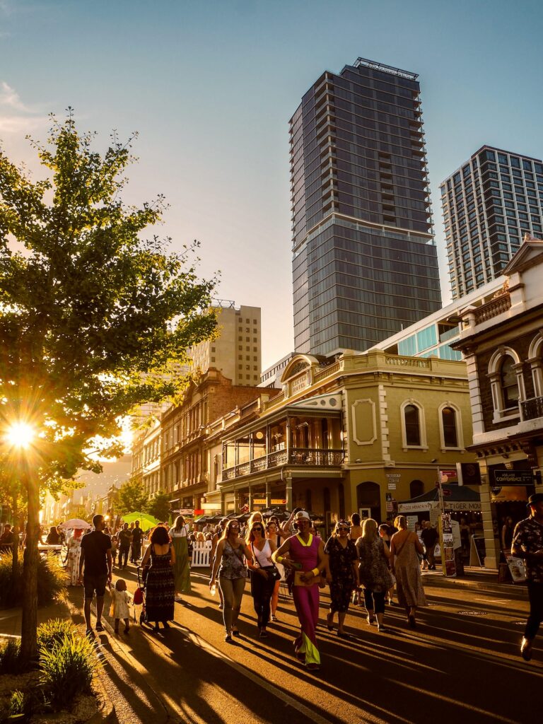 Several people walking down Rundle Street, Adelaide at Sunset