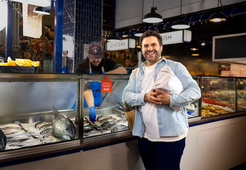 A man buying seafood at Adelaide Central Market